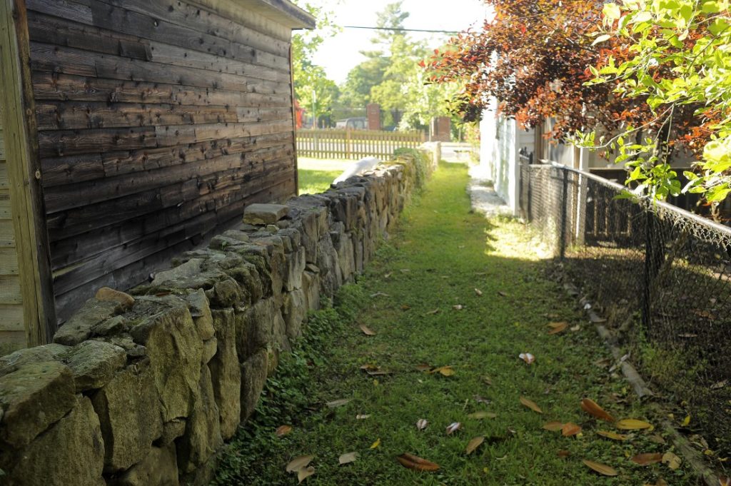 stone wall along free alley
