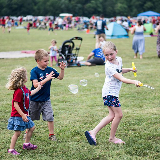 children playing with bubbles